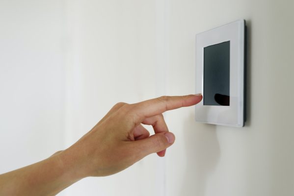 Hand using Air ventilation controller with display Hand using Air ventilation controller with display